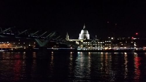 Illuminated city at waterfront