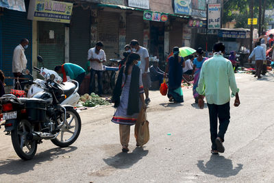 People walking on street in city