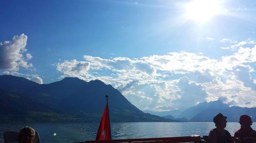 Scenic view of river with mountains in background