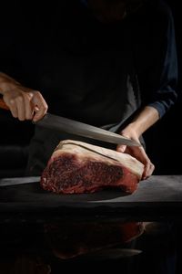 Close-up of man preparing food