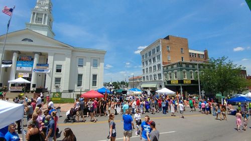 People at town square against sky