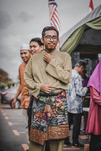 Friends standing on street