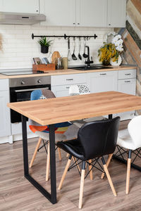 Interior of kitchen in rustic style with vintage kitchen ware and wooden wall