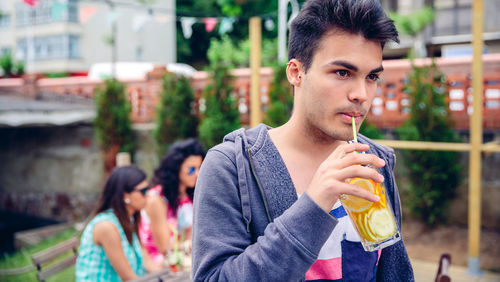 Man drinking juice at restaurant