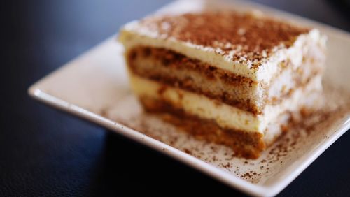 Close-up of cake slice in plate on table