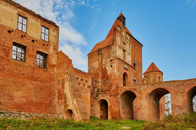 Low angle view of old building against sky