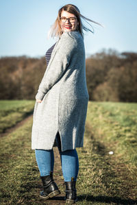 Full length of woman standing on field