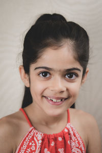 Close-up portrait of a smiling girl