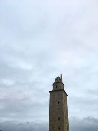 Low angle view of clock tower against sky