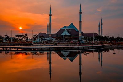 Mosque reflection of city at sunset