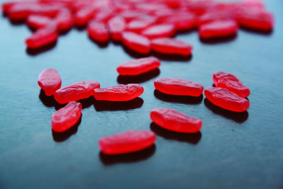 Close-up of red gummi bears on table