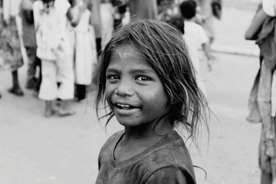 Close-up portrait of girl standing outdoors