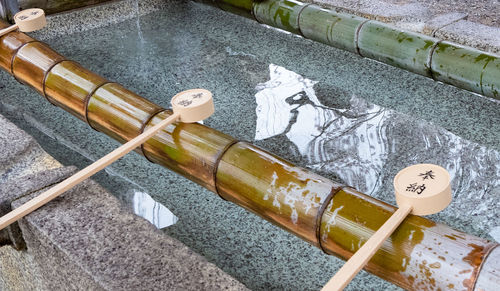 High angle view of cigarette on water