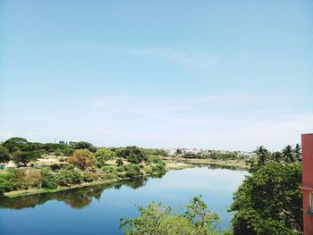 Scenic view of lake against blue sky