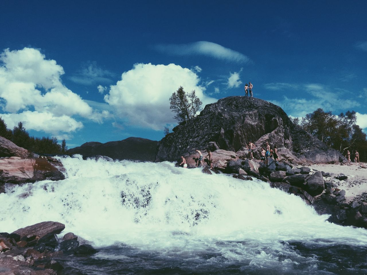 water, sky, scenics, beauty in nature, mountain, rock - object, cloud - sky, motion, nature, tranquil scene, tranquility, rock formation, flowing water, waterfall, cloud, idyllic, non-urban scene, day, cloudy, tree