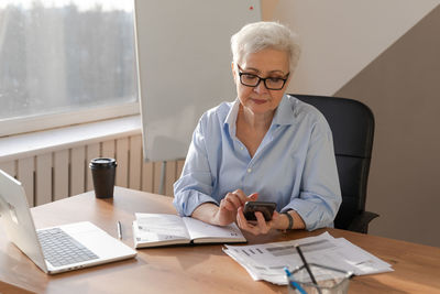 Doctor working at desk in office