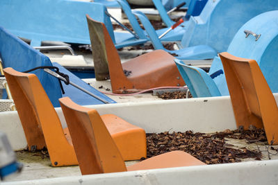 Close-up of chairs on beach