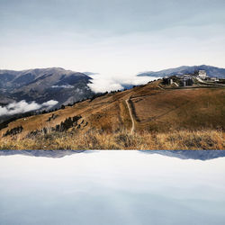 Scenic view of snowcapped mountains against sky