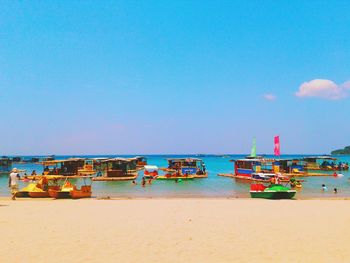 Scenic view of beach against blue sky