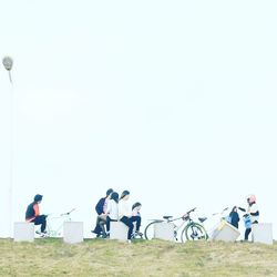 Low angle view of people against sky