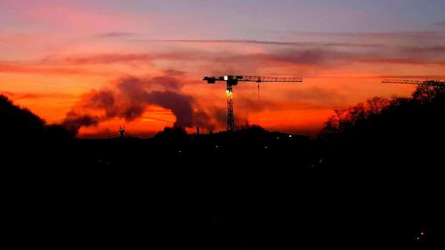 Silhouette trees against sky during sunset