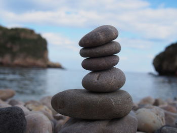 Close-up of stack of pebbles on beach