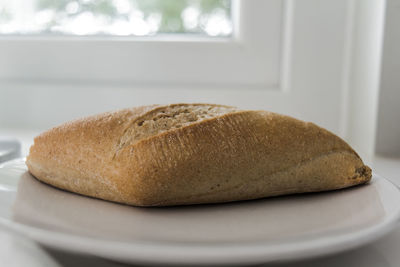 Close-up of bread in plate on table