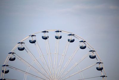 Low angle view of ferris wheel against clear sky