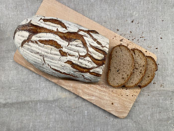 High angle view of bread on cutting board