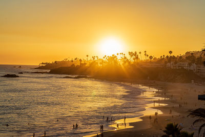 Scenic view of sea against orange sky