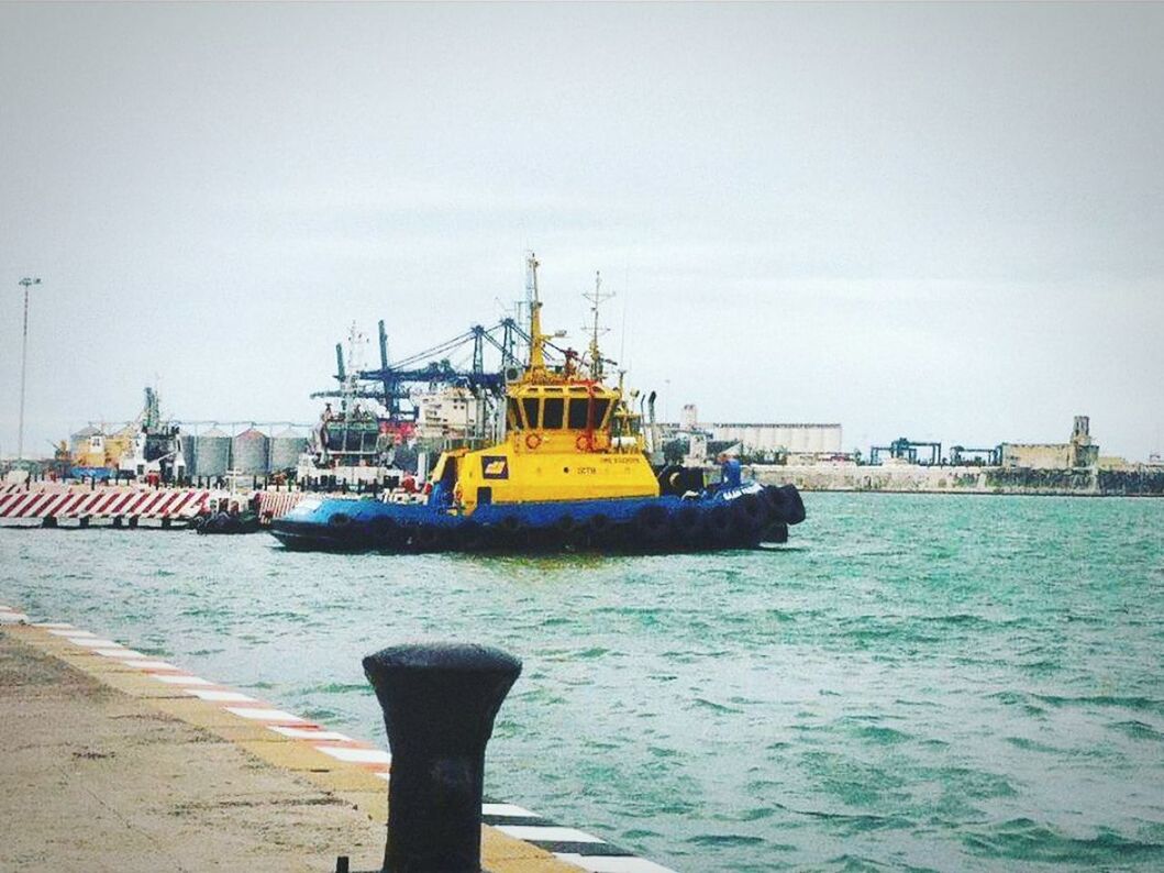 SHIP MOORED AT HARBOR