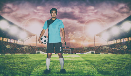 Digital composite image of soccer player while standing on field against sky