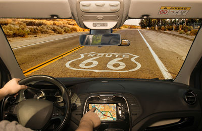 Man using global positioning system in car 