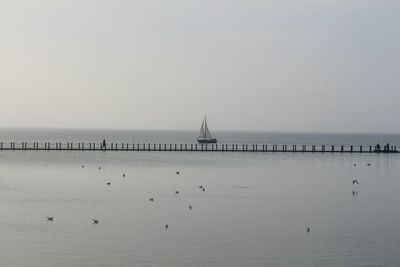 Calm sea against clear sky