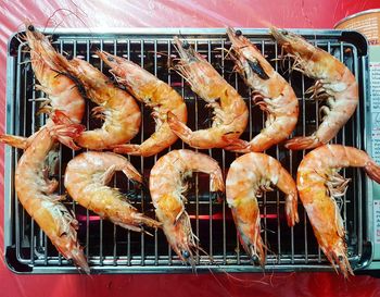 High angle view of meat on barbecue grill