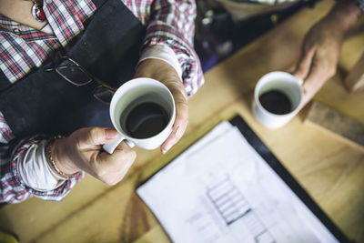 High angle view of coffee cup on table