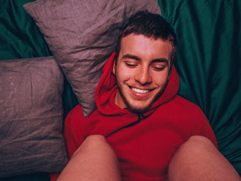 Midsection of man lying down on bed