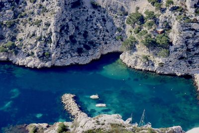 High angle view of rock formation in sea