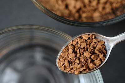 High angle view of coffee beans in glass on table