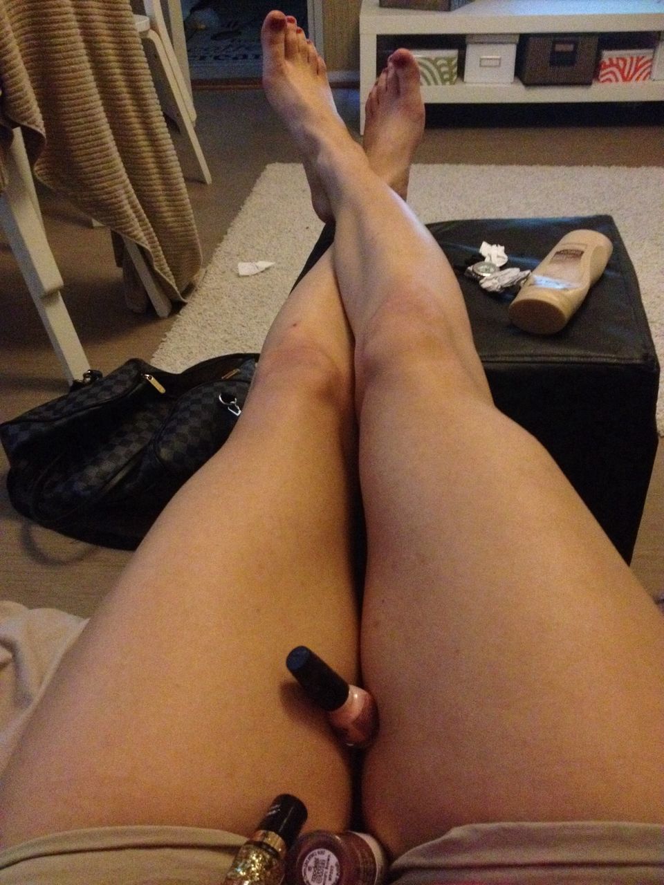 person, low section, lifestyles, part of, sitting, indoors, relaxation, barefoot, human foot, personal perspective, leisure activity, legs crossed at ankle, cropped, lying down, human finger