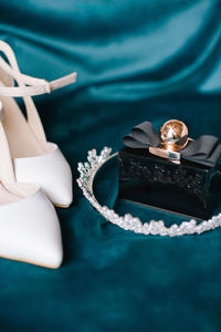 Bridal accessories. bridal shoes, perfume and crown.