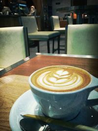 Close-up of coffee cup on table