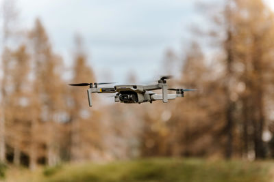 Close-up selective focus photo of small drone in air