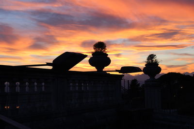 Silhouette trees against sky during sunset