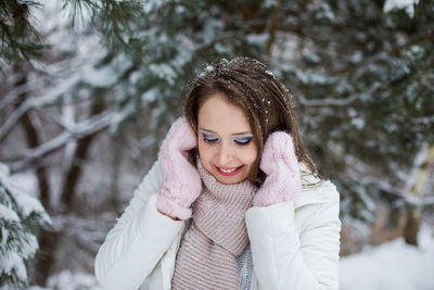 Portrait of a smiling young woman in winter