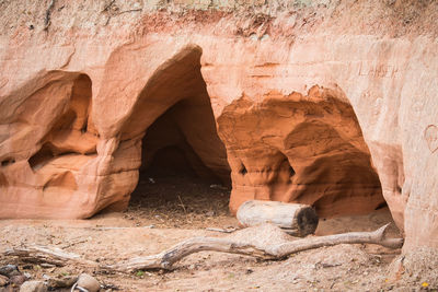 A beautiful seaside landscape with a sandstone caves. orange sandstone shore at the baltic sea. 