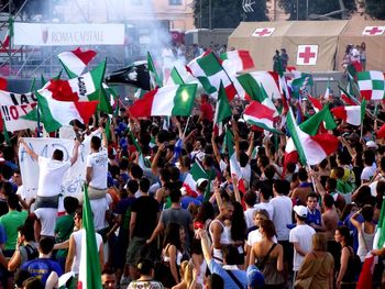 Crowd with flags in city during event