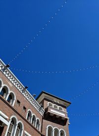 Low angle view of building against blue sky