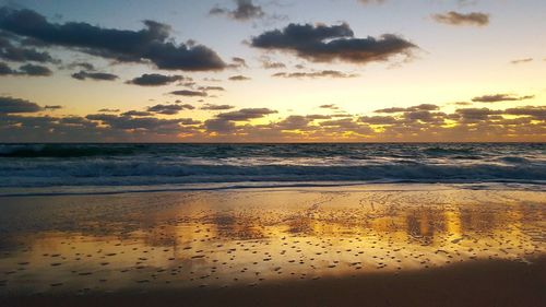 Scenic view of sea at sunset