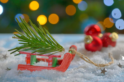 Close-up of frozen christmas decorations during winter